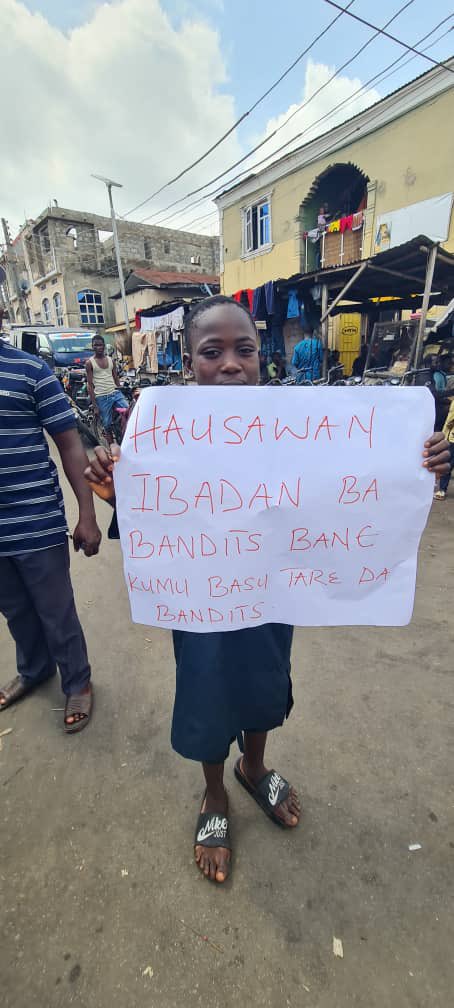 Even children take up the placard